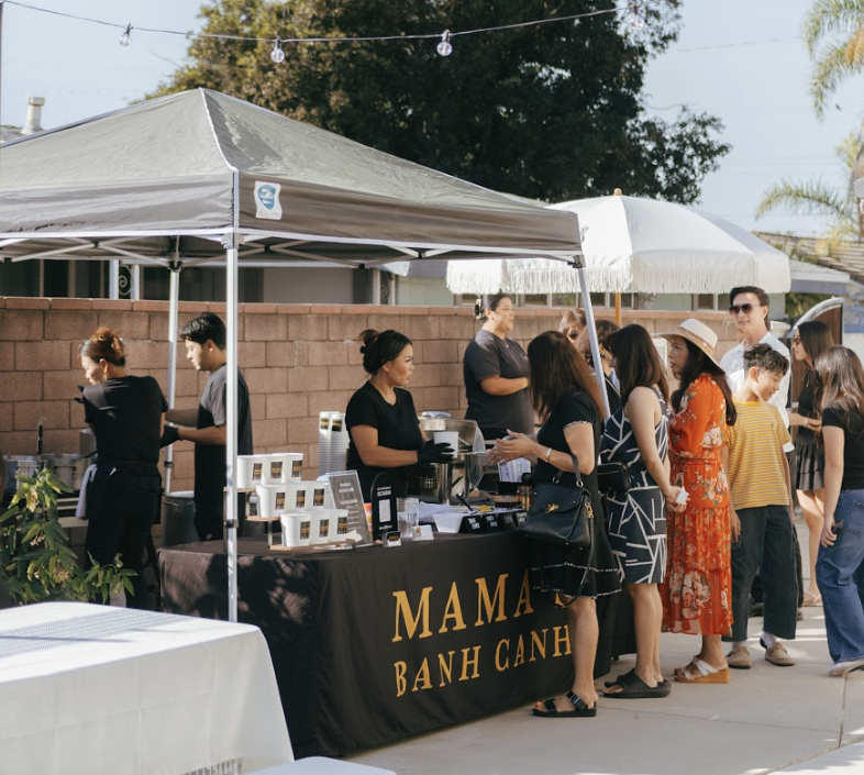 Mama's Banh Canh catering booth setup at an event